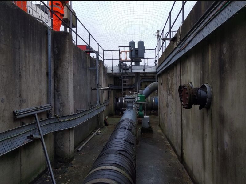 Asbestos surveyor conducting intrusive inspection at infrastructure project location