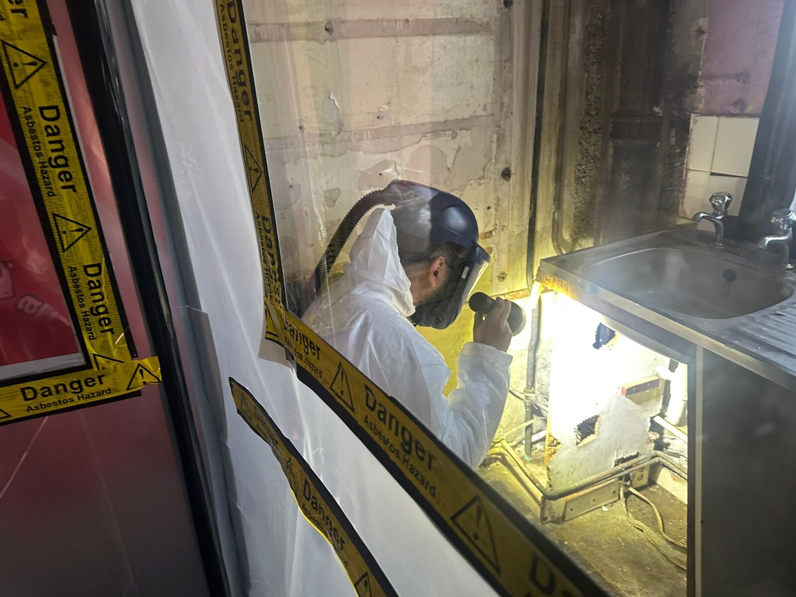 Personal air monitoring being conducted by Clearscan operative during utilities asbestos works